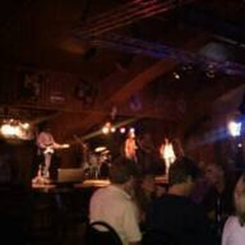 Beacon Club - a group of people sitting at a bar - American Near Me - Mills, Wyoming Beacon Club - a group of people sitting at a bar - American Near Me - Mills, Wyoming
