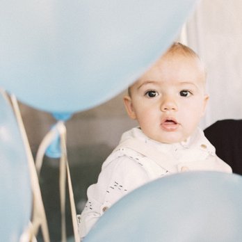 Remember Makers - 1st birthday boy behind the balloons - Event Photography Near Me Remember Makers - 1st birthday boy behind the balloons - Event Photography Near Me