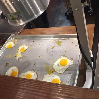 Sizzle&Crunch - Mediocre eggs pre-fried and sitting on a pan with questionable heat lights that aren't on. - Vietnamese Near Me - Seattle, Washington Sizzle&Crunch - Mediocre eggs pre-fried and sitting on a pan with questionable heat lights that aren't on. - Vietnamese Near Me - Seattle, Washington