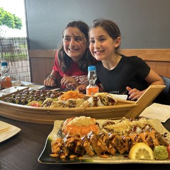 Midami Sushi - The boat of sushi where Josie on the right birthday chose it all!! Her fav restaurant!! - Sushi Bars Near Me - Farmington Hills, Michigan