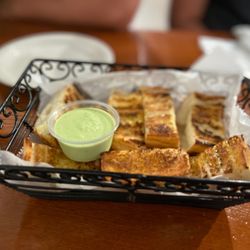 Sabor Inka - Complimentary bread.. the green sauce is so addicting and delicious on everything.. the heat is unexpected but perfect.