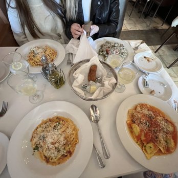 Bugatti Bistro - Plate at the bottom left corner is what is supposed to be "Carbonara Pasta" with red sauce instead of white sauce - Italian Near Me - Coral Gables, Florida Bugatti Bistro - Plate at the bottom left corner is what is supposed to be "Carbonara Pasta" with red sauce instead of white sauce - Italian Near Me - Coral Gables, Florida