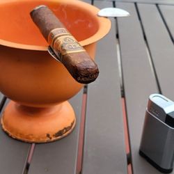 Puro Humo Cigars - Great atmosphere outside seating and inside. Pretty good selection of cigars at a decent price.