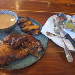 Half chicken, beans and plantains. Super delicious. Half chicken, beans and plantains. Super delicious.