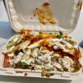 28th & Madison Halal Stand - a half eaten meal in a styrofoam container - Food Trucks Near Me - New York, New York 28th & Madison Halal Stand - a half eaten meal in a styrofoam container - Food Trucks Near Me - New York, New York