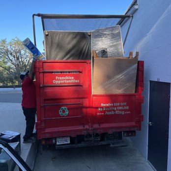 Junk King Orange County - JD and Jesus adding the final bits to a full load. - Junk Removal & Hauling Near Me - Irvine, California Junk King Orange County - JD and Jesus adding the final bits to a full load. - Junk Removal & Hauling Near Me - Irvine, California