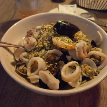Milano's - Shrimp, Clams, Mussels, Calamari, over Linguine with White Garlic Sauce. - Pizza Near Me - Chicopee, Massachusetts Milano's - Shrimp, Clams, Mussels, Calamari, over Linguine with White Garlic Sauce. - Pizza Near Me - Chicopee, Massachusetts
