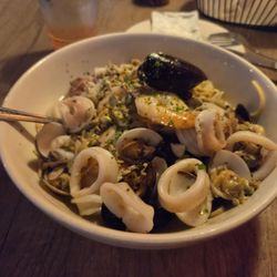 Shrimp, Clams, Mussels, Calamari, over Linguine with White Garlic Sauce.