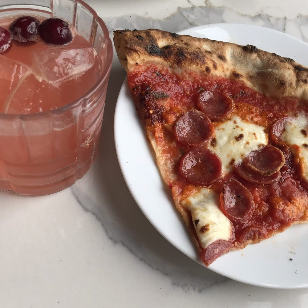 Pizza slice and a cocktail