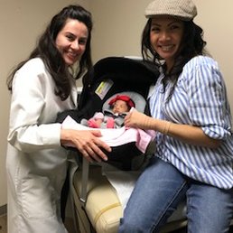Taken with Dr. Mozayeni and our daughter Brynne Marie, 2 weeks after our successful planned C-section. Taken with Dr. Mozayeni and our daughter Brynne Marie, 2 weeks after our successful planned C-section.