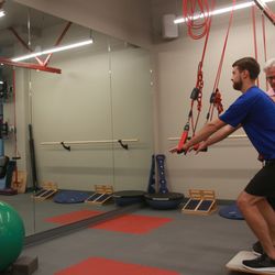FROGS Physical Therapy - Redcord system is great to improve eccentric strength and core stability