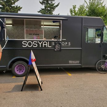 Sosyal Scoops - a woman standing in front of a food truck - Ice Cream & Frozen Yogurt Near Me