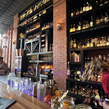 El Moro Spirits & Tavern - a bar with people sitting at the bar - New American Near Me - Durango, Colorado El Moro Spirits & Tavern - a bar with people sitting at the bar - New American Near Me - Durango, Colorado