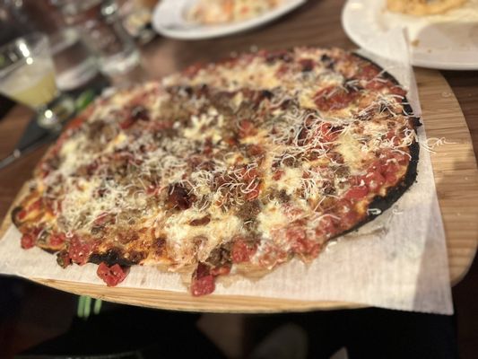 Photo of Felice 56 - New York, NY, US. a pizza on a wooden cutting board