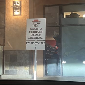 Pizza Hut - a sign in the window of a restaurant - Pizza Near Me - Calexico, California Pizza Hut - a sign in the window of a restaurant - Pizza Near Me - Calexico, California