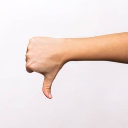 a hand with a thumb down a hand with a thumb down