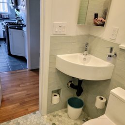 Tiny powder room required creative solutions