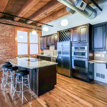 Truss Interiors & Renovations - Full sit in kitchen complete with a wine rack and polished cabinets - Interior Design Near Me - Denver, Colorado Truss Interiors & Renovations - Full sit in kitchen complete with a wine rack and polished cabinets - Interior Design Near Me - Denver, Colorado