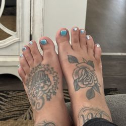 Nail Tek - Excuse my slipper tan lol. I love my chrome gel. I get it Everytime I come here.
