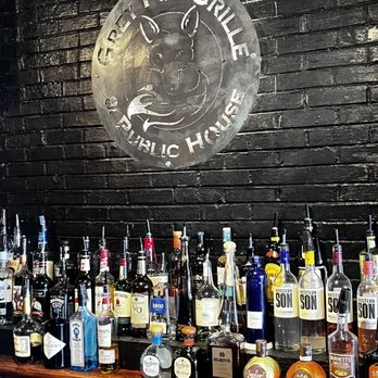 Grey Fox Grille - bottles of alcohol lined up on a bar - Bars Near Me - Dover, Delaware