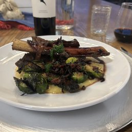 Braised short ribs, herbed polenta, crispy brussel sprouts with pancetta & shallots, a port reduction and topped off with a gremolata Braised short ribs, herbed polenta, crispy brussel sprouts with pancetta & shallots, a port reduction and topped off with a gremolata