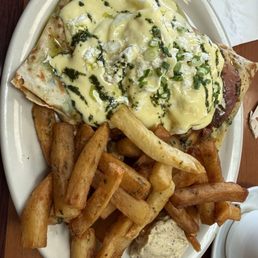 THE CREPE BENEDICT! The crepe Benedict was divine. A good portion! The dressing for the fries was a little different and very delicious. THE CREPE BENEDICT! The crepe Benedict was divine. A good portion! The dressing for the fries was a little different and very delicious.