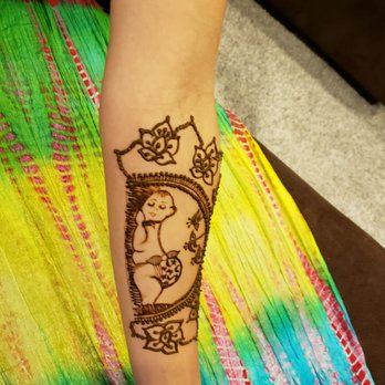 Love Aum Henna Creation and Threading - Design on mother-to-be - Henna Artists Near Me - Irvine, California