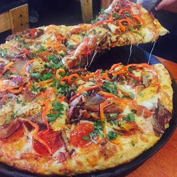 Moose's Tooth - Santas little helper thick crust size medium. My husband had two pieces and was stuffed. Get a small! - Pizza Near Me - Anchorage, Alaska