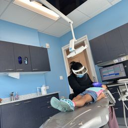 Hygienist cleaning my daughter's teeth Hygienist cleaning my daughter's teeth
