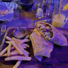 Steak Burrito with fries and the last bit of a mangolada Steak Burrito with fries and the last bit of a mangolada