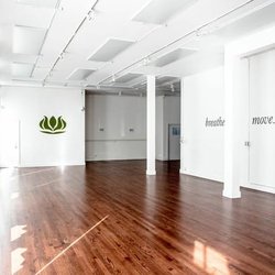 Our expanded yoga room has space for up to 60 mats! We also offer changing rooms, and mat storage space.