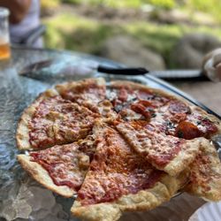 Cate's Italian Garden Restaurant and Bar - The BEST Pizza in upstate NY! Not joking. Sit outside Cates. You will not be disappointing. Thin crust, and crispy! Loved it
