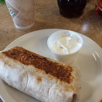 Gina's Cafe - Custom burrito with bacon, cheddar, hash browns, and side of sour cream. The drink was a snickers bar mocha. - Cafes Near Me - Stockton, California