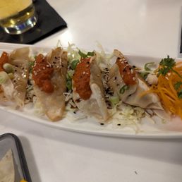 Beef dumplings with kimchi on top