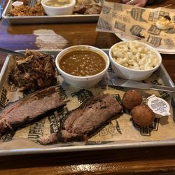 Maverick's Smokehouse & Taproom - 1/2 lb Brisket, pulled 1/2 lb Pork, baked Bourbon Beans, Mac N Cheese, Little Devils, 1/2 lb Sausage, pulled chicken
