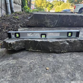 Handy Home Repairs - Stones sloping towards the house - General Contractors Near Me