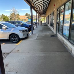 The silver car is theirs and the door is their shop