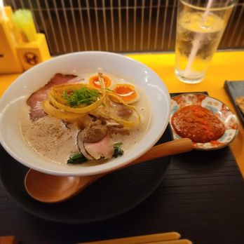 Mensho - Signature toripaitan with side of spicy sauce - Noodles Near Me - Houston, Texas