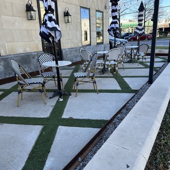 Village Baking Co - a patio with chairs and umbrellas - Bakeries Near Me - Dallas, Texas Village Baking Co - a patio with chairs and umbrellas - Bakeries Near Me - Dallas, Texas