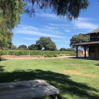 Roblar Winery - Outdoor Grass Area with benches - Wineries Near Me - Santa Ynez, California Roblar Winery - Outdoor Grass Area with benches - Wineries Near Me - Santa Ynez, California