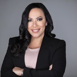 Fantaxtic Services LLC - Tax Preparer Eyoshi Castillo with crossed arms