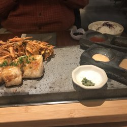Akira - Saikyo miso silver cod sumiyaki and vegetable kakiage on a sizzling hot stone slab
