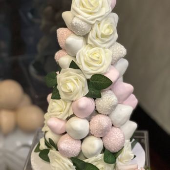 Cake Boutique - a three tiered cake with marshmallows and roses - Custom Cakes Near Me - Staten Island, New York