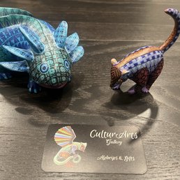 Beautiful ajolote (axolotl) and coati alebrijes