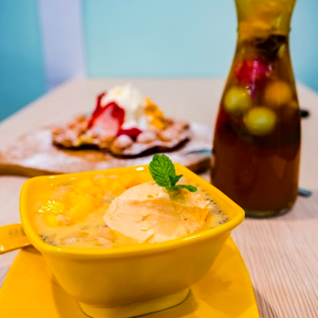 UC Dessert - Mango Sago with the fruit fusion drink and the egg puff dessert in the back - Desserts Near Me - Oakland, California UC Dessert - Mango Sago with the fruit fusion drink and the egg puff dessert in the back - Desserts Near Me - Oakland, California