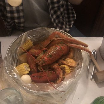 Angie's Seafood - Seafood boil special. Lobster snow crab legs blue claws shrimp sausage potatoes corn and two hard boiled eggs! My son finished it! - Seafood Near Me - Baltimore, Maryland