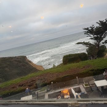 Moss Beach Distillery - View from our table... down below on the outdoor seating there are fire pits... - Seafood Near Me - Moss Beach, California