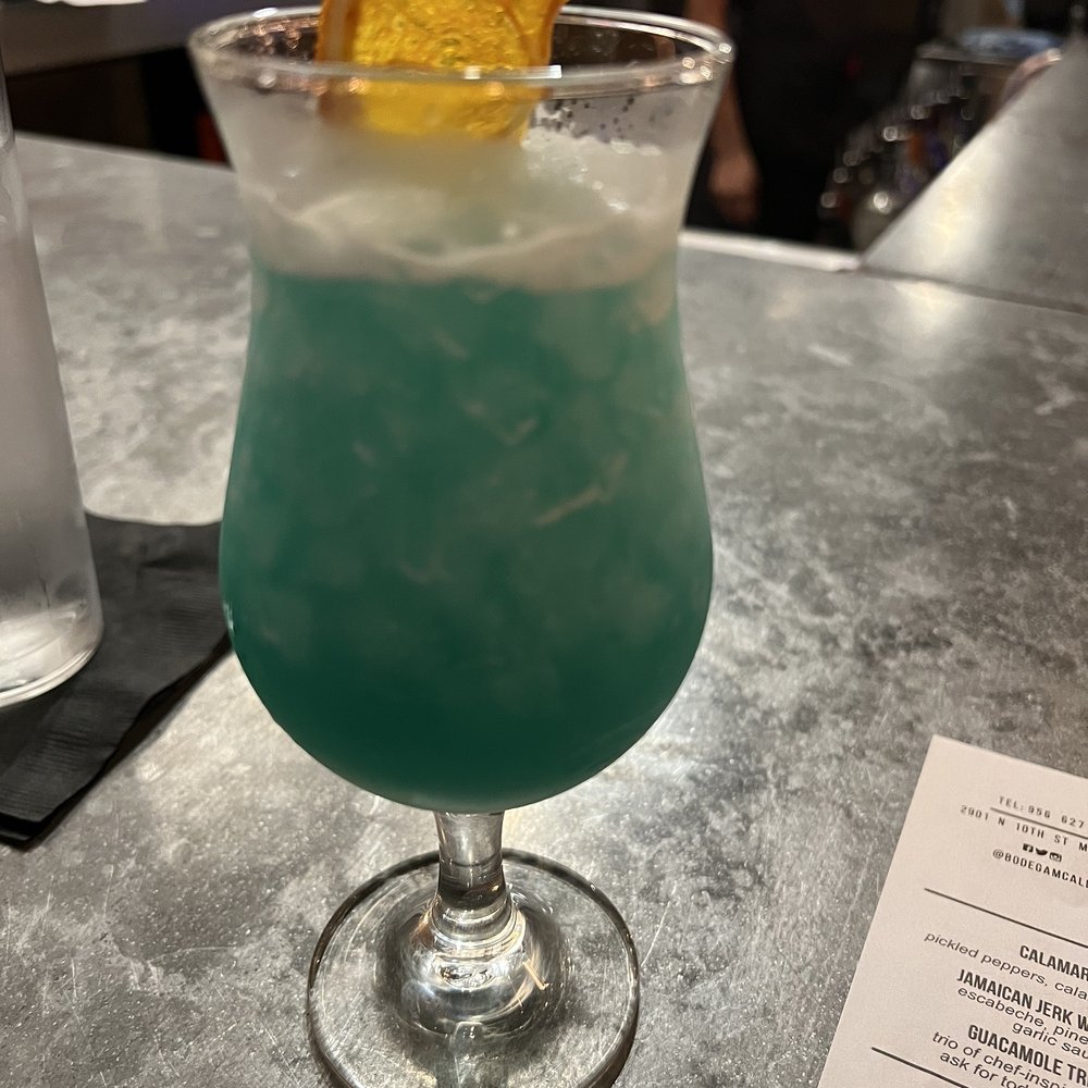 Bodega Tavern & Kitchen - Blue Hawaiian cocktail - Bars Near Me - McAllen, Texas Bodega Tavern & Kitchen - Blue Hawaiian cocktail - Bars Near Me - McAllen, Texas