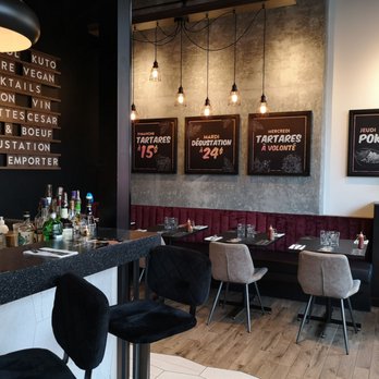 Küto - a restaurant with a bar and chairs - International Near Me - Montreal, Quebec Küto - a restaurant with a bar and chairs - International Near Me - Montreal, Quebec