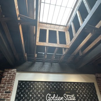 Golden State Coffee Roasters - Beautiful open concept, skylight ceiling makes the place feel more open with the Golden State logo on the wall. - Coffee Roasteries Near Me - Placentia, California Golden State Coffee Roasters - Beautiful open concept, skylight ceiling makes the place feel more open with the Golden State logo on the wall. - Coffee Roasteries Near Me - Placentia, California